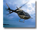 Photo of a Bell 206 helicopter flying through stormy clouds