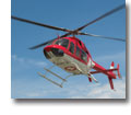 Photo of an EMS helicopter hovering in the sky