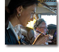 Photo of a flight attendant talking with the pilot in the cockpit of a Boeing 747