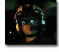 Photo of pilot wearing night vision googles