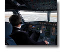 Photo of pilot inside cockpit of Airbus 320-214 lining up on runway to takeoff