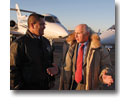Photo of pilots with a Lear 60 business jet in the background