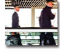 Photo of airplane staff on a moving walkway