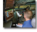Photo of crewmembers training in a Rockwell Collins simulator