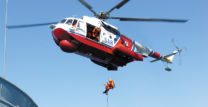 Search and rescue helicopter rescuing a person