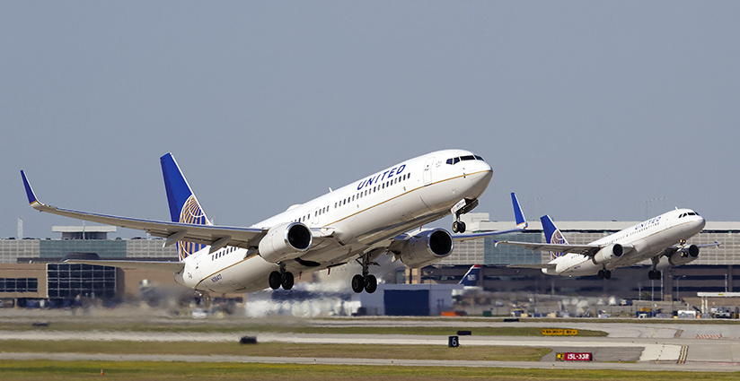 Two United Airlines airplanes taking off.