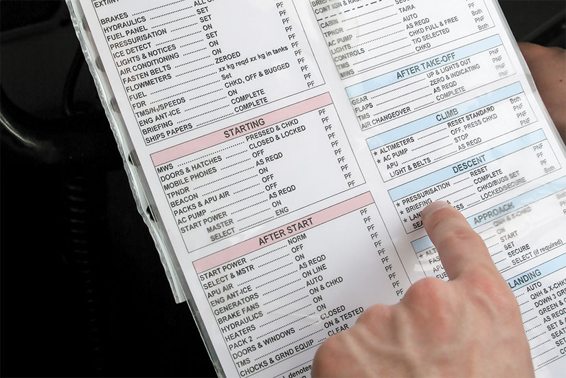 A pilot going through a checklist