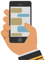 Hand holding a phone with a messaging screen.