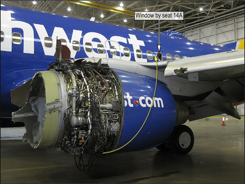 Photo of damaged engine and window of the accident aircraft