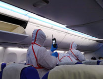 photo of quarantine staff screening passengers in Shenzhen, China